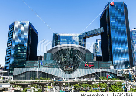 A train on the Wenhu or Brown Line of the Taipei MRT passes by the Mitsui Shopping Park LaLaport Taipei Nangang. A train on the Wenhu or Brown Line of the Taipei MRT passes by the Mitsui Shopping Park LaLaport Taipei Nangang. 137343931
