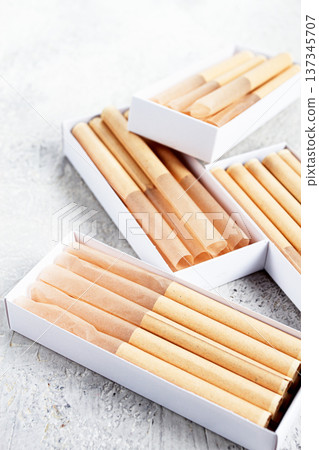 cigarette casings, packed in boxes, on the table, top view, 137345707