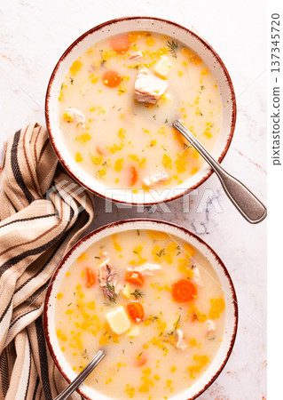 Finnish fish soup, lohikeito soup, creamy fish soup, two bowls of soup, 137345720