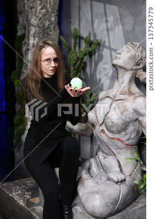 Serene botanical display with weathered stone and verdant accents 137345779