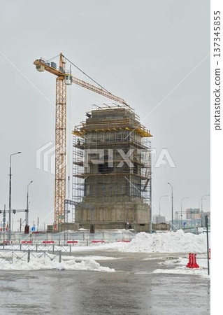 City intersection undergoing maintenance during snowy winter conditions City intersection undergoing maintenance during snowy winter conditions 137345855