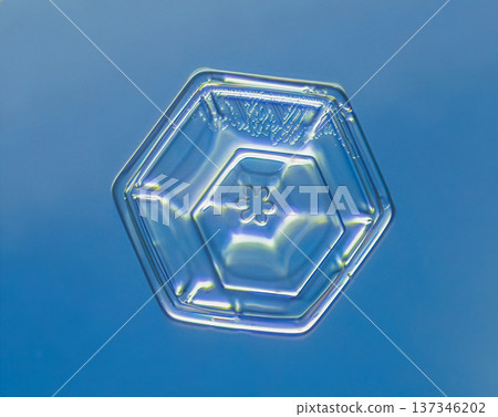 Natural snowflake crystal in blue background Natural snowflake crystal in blue background 137346202
