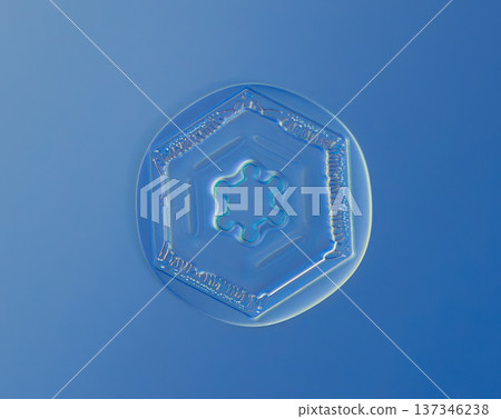 Natural snowflake crystal in blue background Natural snowflake crystal in blue background 137346238