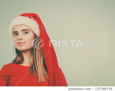 Woman wearing Santa Claus helper costume Woman wearing Santa Claus helper costume 137346759