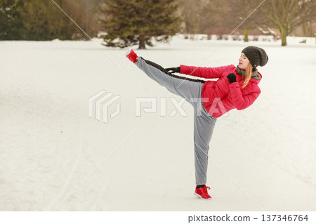 Woman wearing sportswear training boxing outside Woman wearing sportswear training boxing outside 137346764