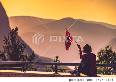 Tourist enjoy fjord view on Stegastein viewpoint Norway Tourist enjoy fjord view on Stegastein viewpoint Norway 137347141