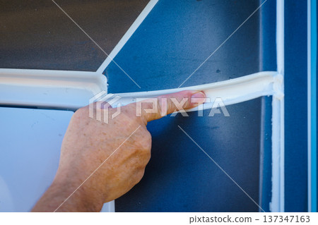 Applying silicon on caravan body 137347163