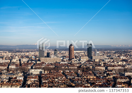 Lyon, france. December 27, 2023. Lyon cityscape showing the modern business district part-dieu with its skyscrapers and historical buildings, distant alps visible 137347353