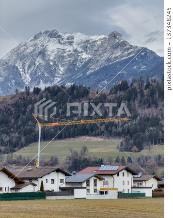 Idyllic Rural Community Situated Beside Majestic Snowy Summits And Lush Fields Idyllic Rural Community Situated Beside Majestic Snowy Summits And Lush Fields 137348245