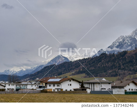 Idyllic Rural Community Situated Beside Majestic Snowy Summits And Lush Fields Idyllic Rural Community Situated Beside Majestic Snowy Summits And Lush Fields 137348246