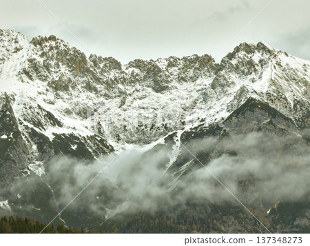 Vast Snowcovered Mountains Amid Foggy Trees And Cool Atmosphere Vast Snowcovered Mountains Amid Foggy Trees And Cool Atmosphere 137348273