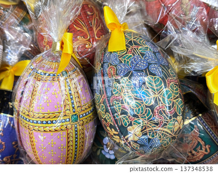Colorful easter chocolate eggs in festive gift packaging. Colorful easter chocolate eggs in festive gift packaging. 137348538