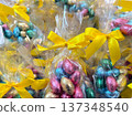 Colorful easter chocolate eggs in festive gift packaging. 137348540