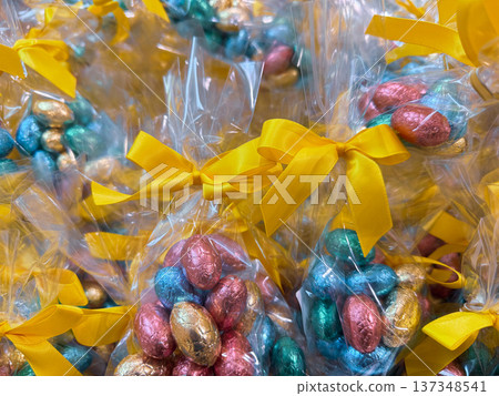 Colorful easter chocolate eggs in festive gift packaging. Colorful easter chocolate eggs in festive gift packaging. 137348541