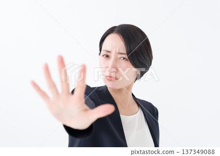 Businesswoman stopping with her hand Businesswoman stopping with her hand 137349088