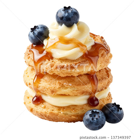 Tempting stack of golden cream puffs profiteroles filled with cream, topped with fresh blueberries and a sweet caramel drizzle, isolated Tempting stack of golden cream puffs profiteroles filled with cream, topped with fresh blueberries and a sweet caramel drizzle, isolated 137349397