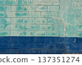 Faded green and blue old concrete block wall 137351274