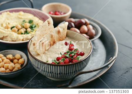 Middle eastern, arabic traditional breakfast with hummus, falafel, mutabbal, 137351303