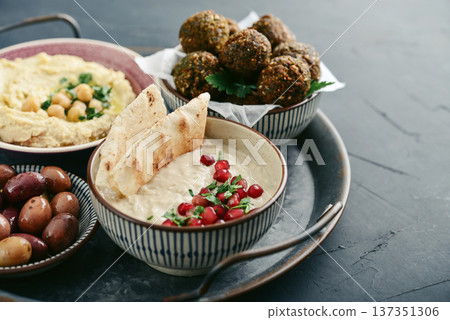 Middle eastern, arabic traditional breakfast with hummus, falafel, mutabbal, 137351306
