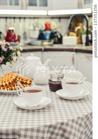 breakfast with tea and a homemade Belgian waffles breakfast with tea and a homemade Belgian waffles 137351356