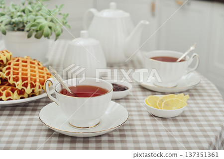 breakfast with tea and a homemade Belgian waffles breakfast with tea and a homemade Belgian waffles 137351361