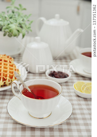 breakfast with tea and a homemade Belgian waffles 137351362