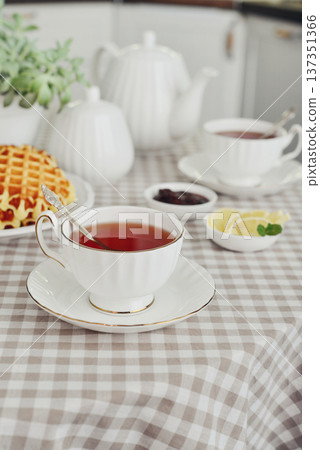 breakfast with tea and a homemade Belgian waffles breakfast with tea and a homemade Belgian waffles 137351366