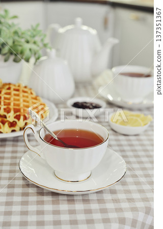 breakfast with tea and a homemade Belgian waffles 137351367