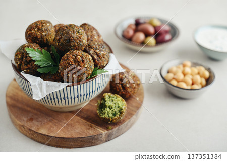 A bowl of crispy golden brown falafel balls 137351384
