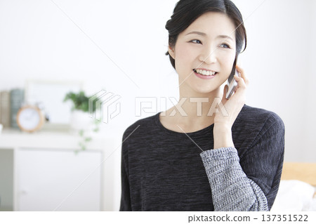 Middle-aged women talking on smartphone 137351522
