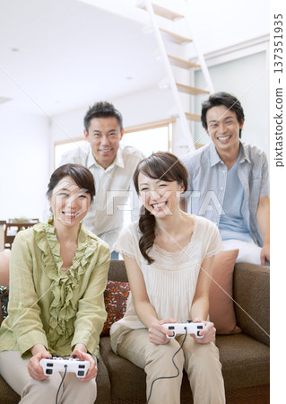 Two-generation family playing games 137351935