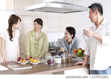 Two-generation family talking in the kitchen Two-generation family talking in the kitchen 137351941