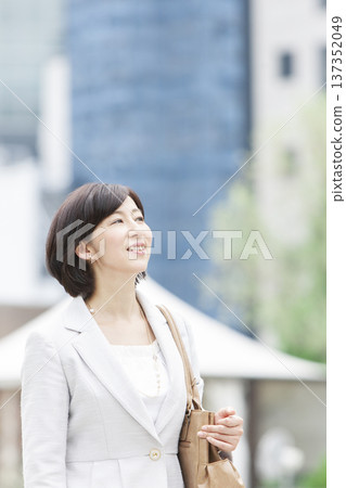 Career woman walking in the office district Career woman walking in the office district 137352049