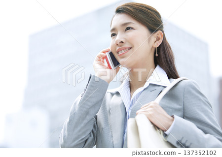 Business woman to call with smartphone 137352102