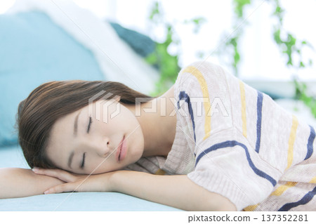 A woman sleeping on the sofa A woman sleeping on the sofa 137352281
