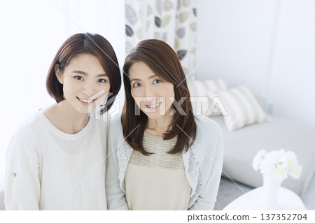 Smiling mother and daughter Smiling mother and daughter 137352704