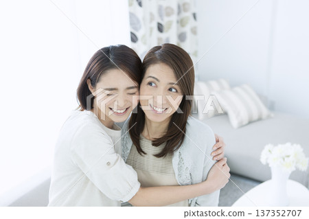 A girl embracing her mother 137352707