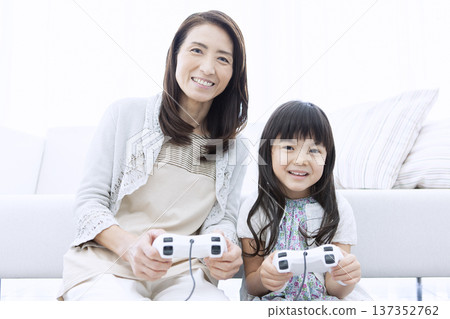 Grandmother and grandson playing video games 137352762