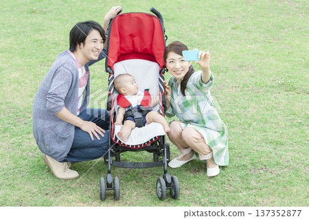 Family taking photos with a smartphone Family taking photos with a smartphone 137352877