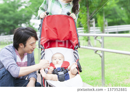 Family walking with baby Family walking with baby 137352881