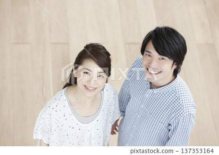 Couple standing in the living room 137353164
