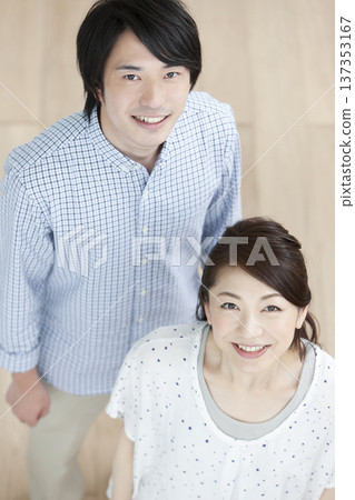 Couple standing in the living room Couple standing in the living room 137353167