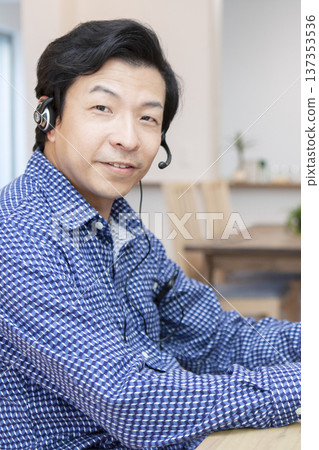 A man who operates a personal computer A man who operates a personal computer 137353536