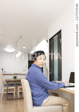 A man who operates a personal computer A man who operates a personal computer 137353540