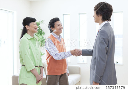 A couple having a meeting with a salesman 137353579