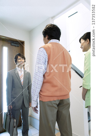 A couple having a meeting with a salesman 137353582