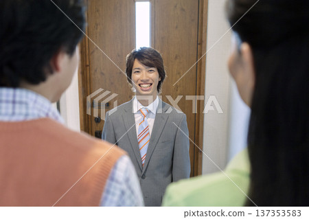 A couple having a meeting with a salesman 137353583