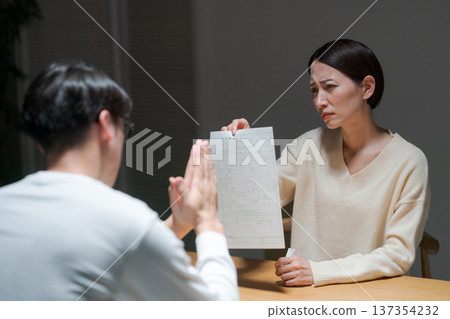Woman presenting divorce papers 137354232
