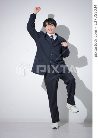 A high school boy looks at the camera with a full-body fist pump, an image of studying for exams and his future career. I'll do my best to pass! A high school boy looks at the camera with a full-body fist pump, an image of studying for exams and his future career. I'll do my best to pass! 137355034