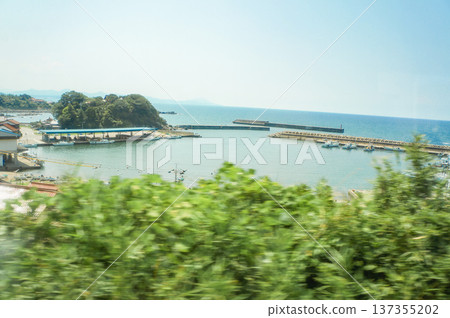 A quiet fishing port and a blue summer sky A quiet fishing port and a blue summer sky 137355202